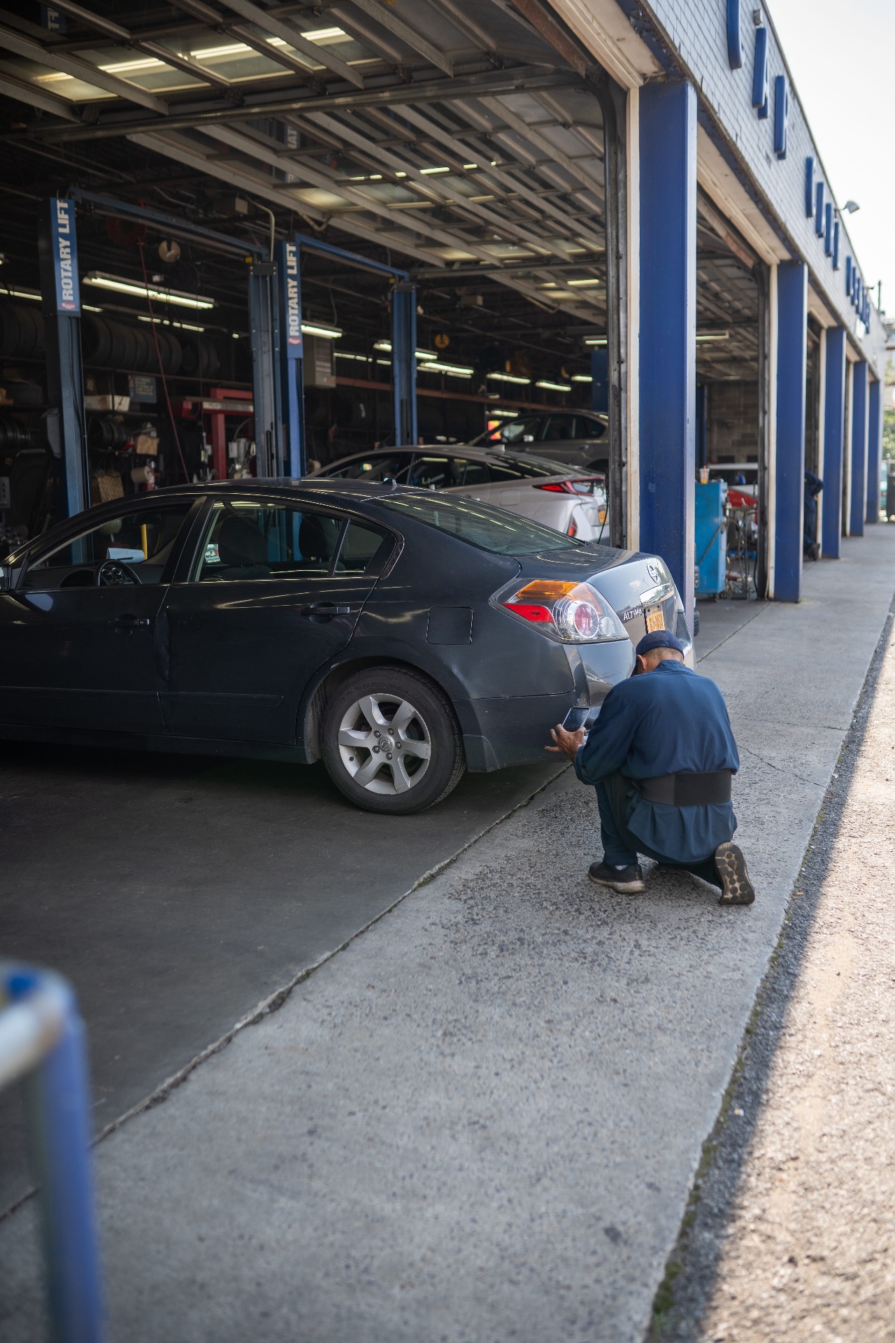 Technician working on suspension repair Bronx